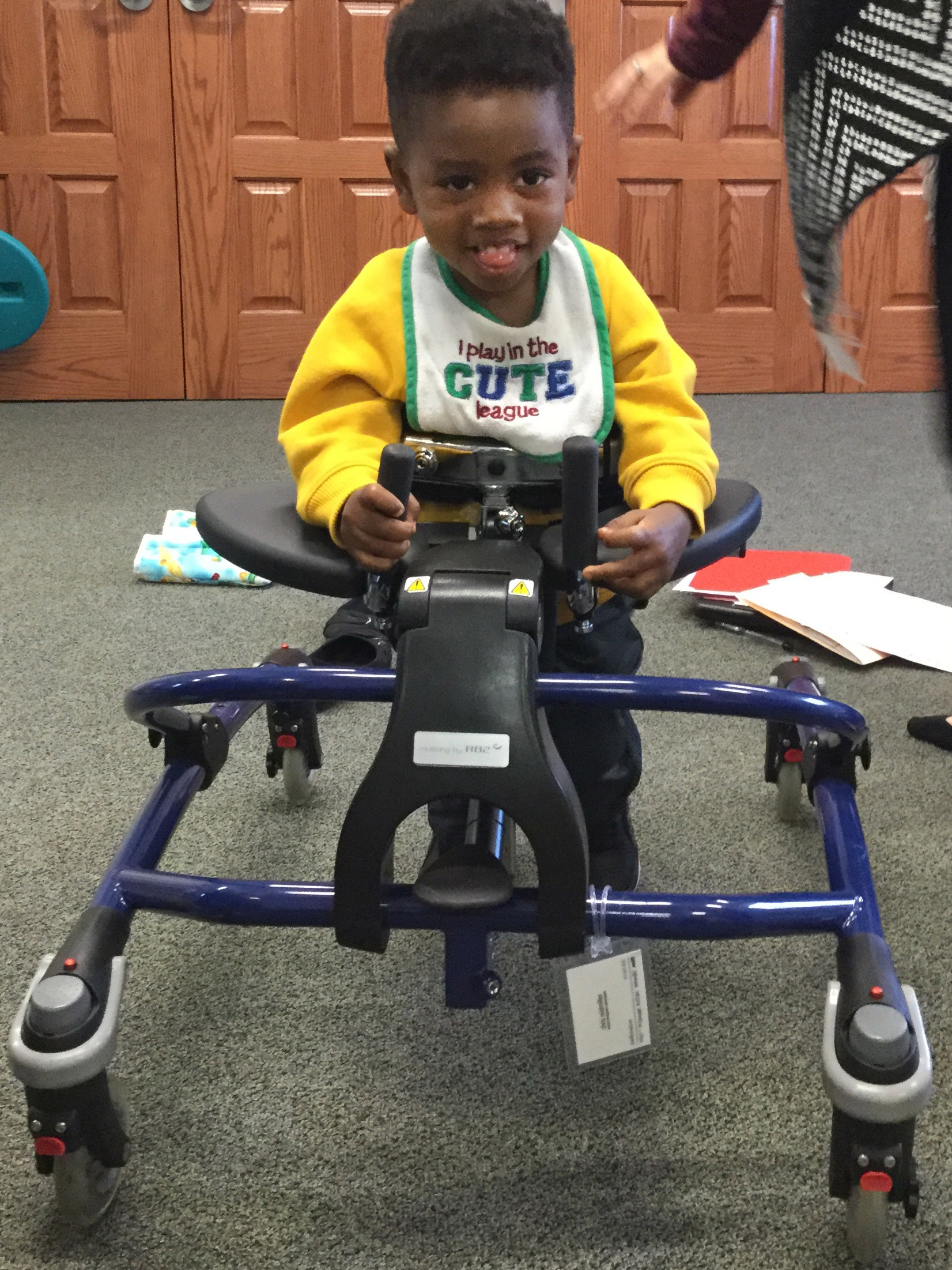 Boy using a gait trainer.